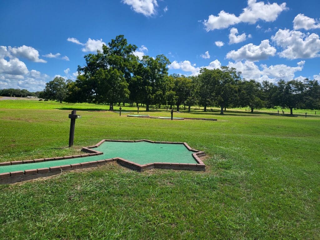 well-maintained mini golf course winding through a pecan grove at Colorado River Thousand Trails campground